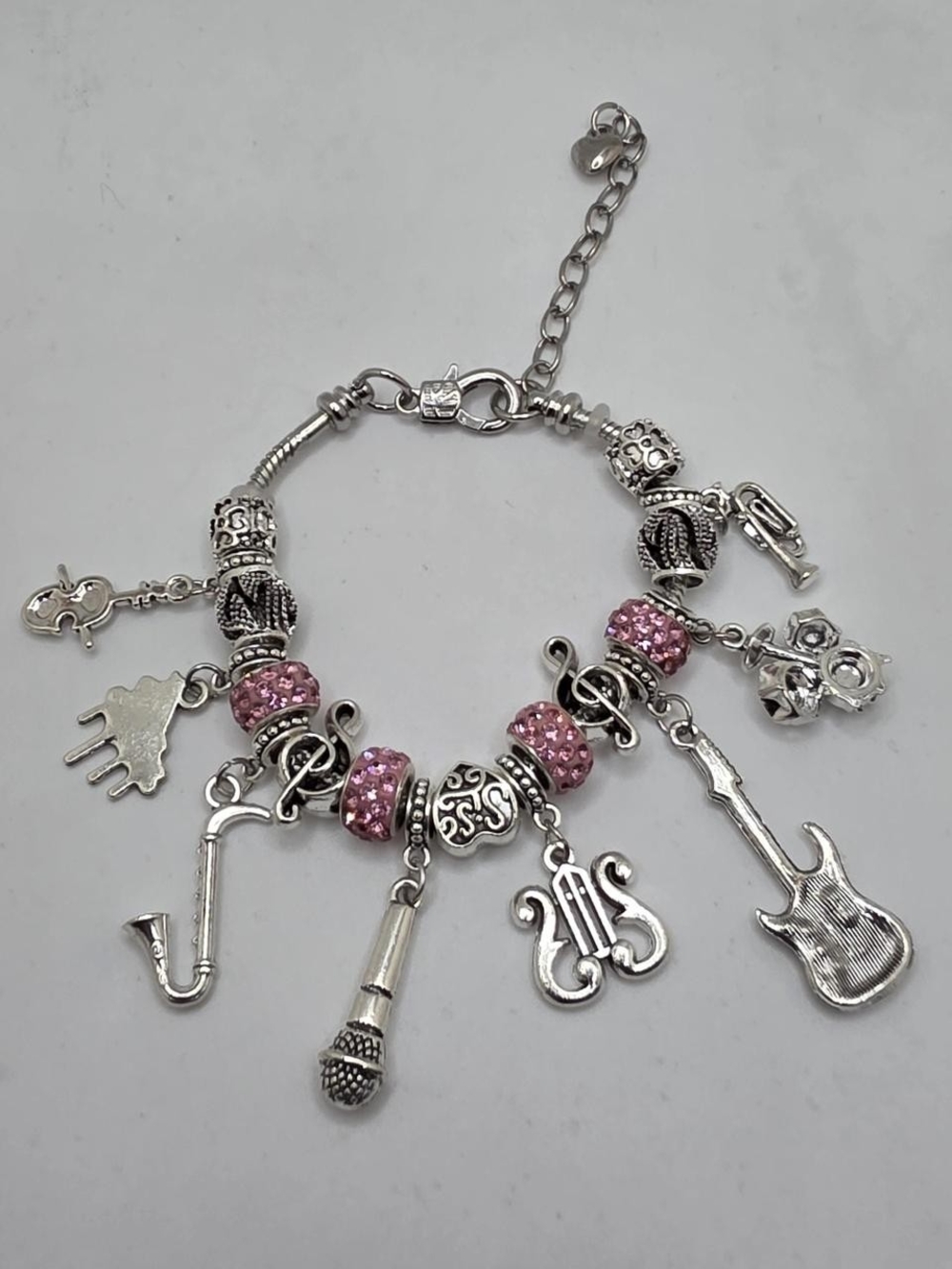 Silver Music Charm Bracelet with Pink Accents